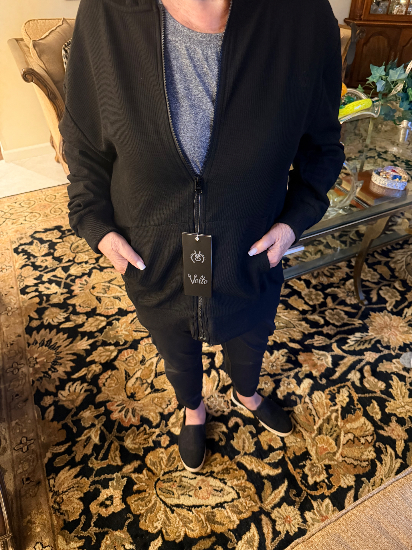 Nanny wearing the black Volto Script Waffle Zip-Up Hoodie